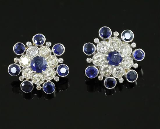 A pair of mid 20th century gold and platinum?, sapphire and diamond flower head cluster ear clips, 19mm.